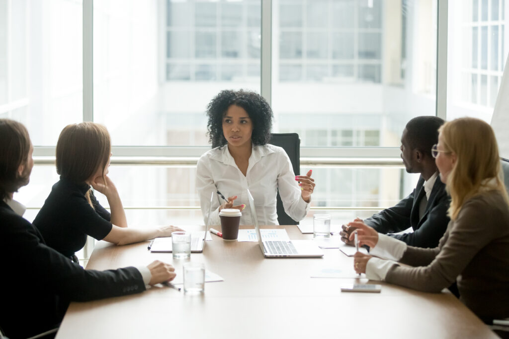 Black women leading group meeting